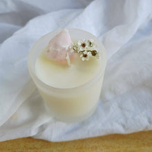 Load image into Gallery viewer, Flower Child with Pink Aragonite Candle with a decorative element on a white fabric background
