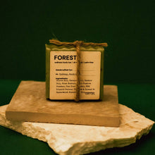 Load image into Gallery viewer, Wooden product labeled 'FOREST' on a stone surface with a dark green background
