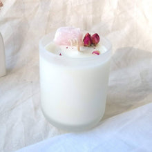 Load image into Gallery viewer, Peony Blossom with Rose Quartz candle with decorative elements on a soft fabric background
