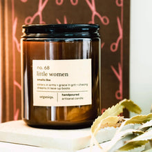 Load image into Gallery viewer, Candle jar labeled 'no. 68 little women' with decorative elements in the background
