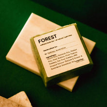 Load image into Gallery viewer, 'FOREST' Bar of soap with a label on a green background

