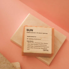 Load image into Gallery viewer, Bar of soap with a label on a pink background
